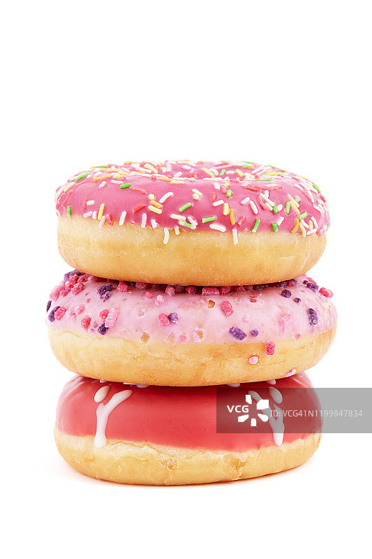 彩色糖粒甜甜圈叠，白色背景图片素材