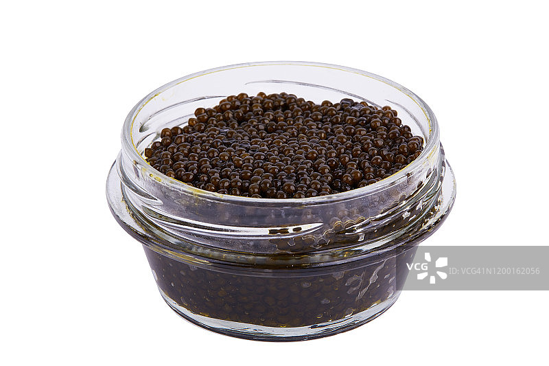 白色背景中玻璃罐装黑色鲟鱼鱼子酱特写图片素材
