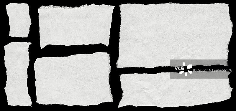 黑色背景上的白色纸片图片素材