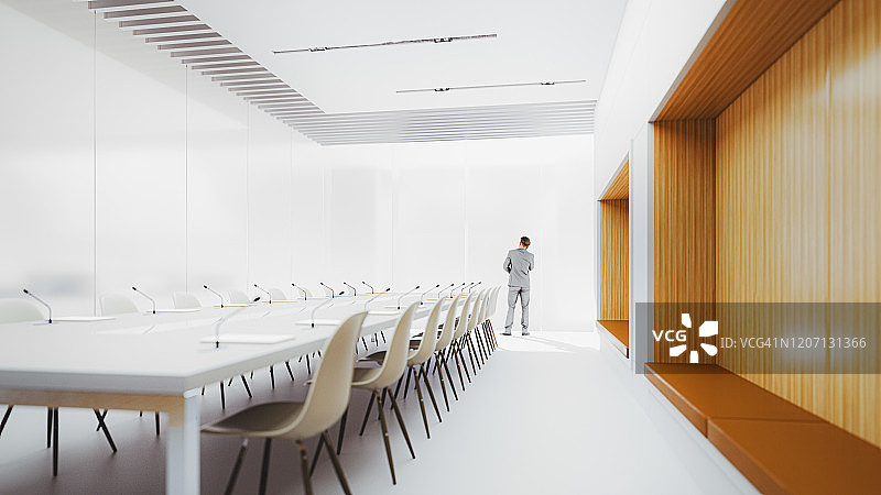 在现代会议室里打电话的商人图片素材