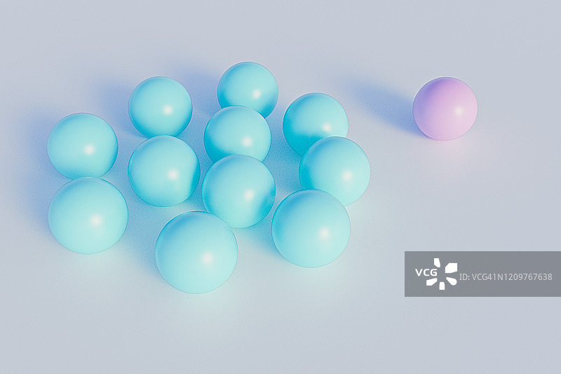 从蓝色球体组中分离出来的粉色球体图片素材