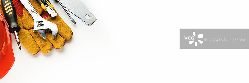 房屋建造或公寓维修工具，白色背景。工头的工作场所。家庭和专业维修与施工主题。文本横幅广告。图片素材
