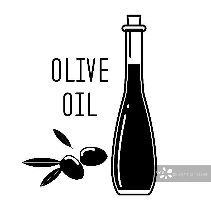 玻璃瓶中的橄榄油和带叶子的绿色橄榄图片素材