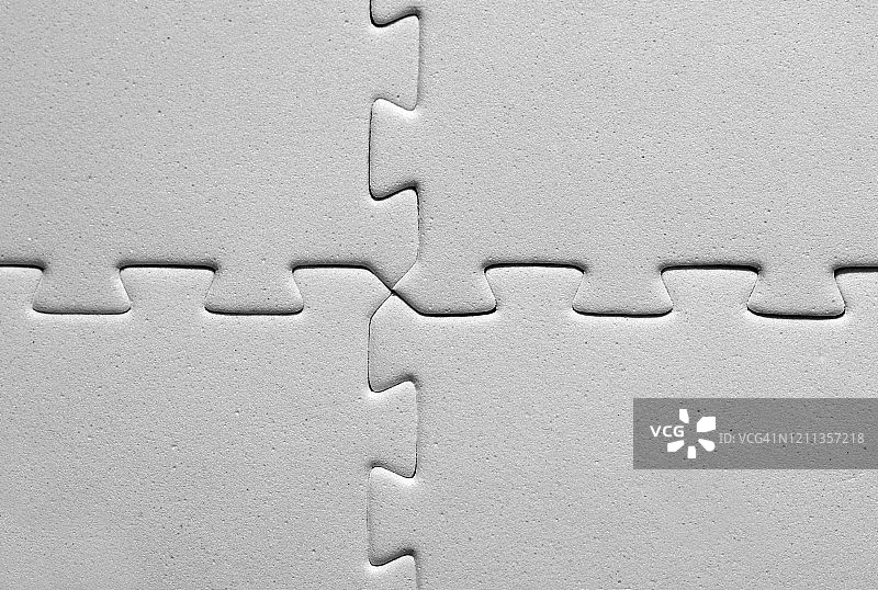 四块互锁的白色拼图图片素材