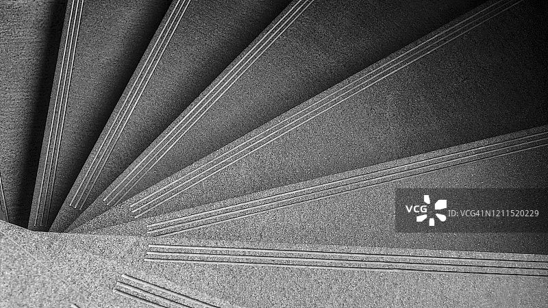 现代螺旋楼梯。家庭或建筑内的豪华内饰。抽象背景。用于添加文本信息的图片。设计艺术作品的背景。图片素材