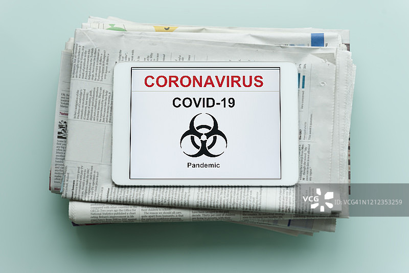 带有新冠病毒文本的数位板图片素材