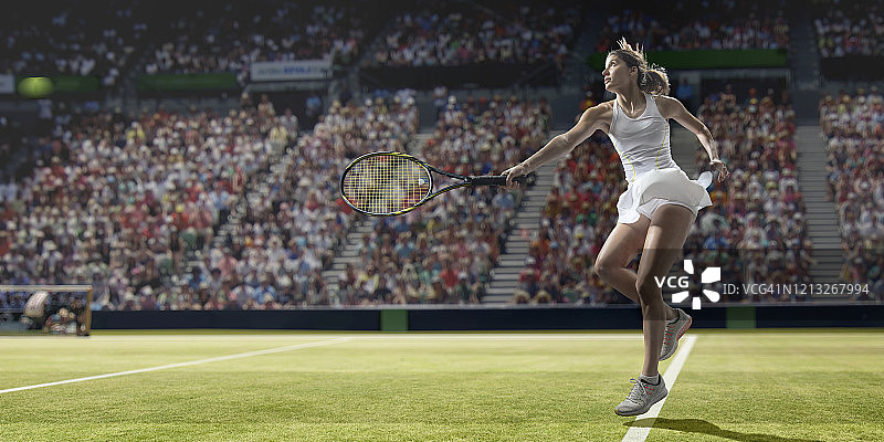 草地上发球的职业网球运动员图片素材