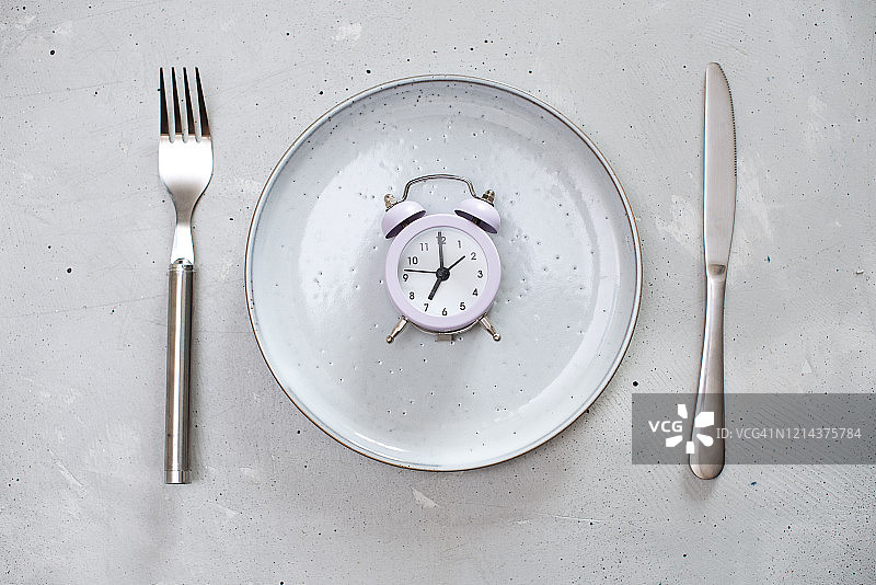 早餐时间概念与闹钟图片素材