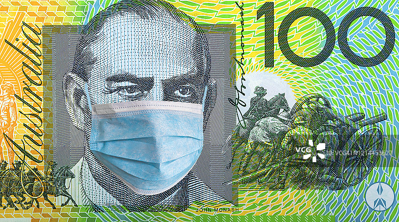 澳大利亚隔离概念与戴口罩的100美元图片素材