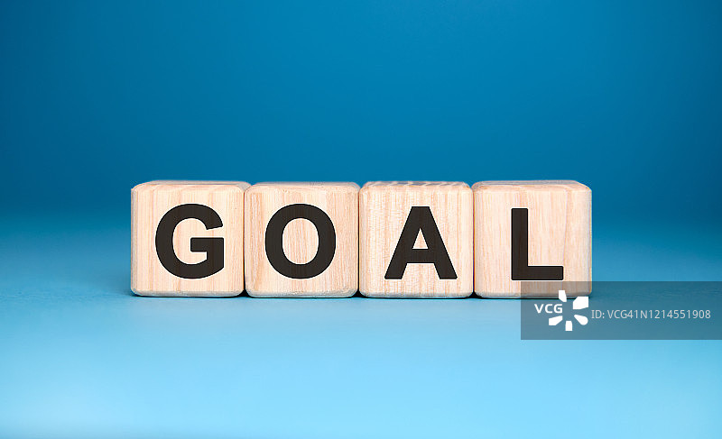 目标-木块上的文字，医疗概念，蓝色背景图片素材