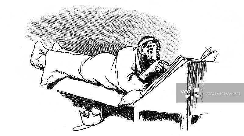 躺着阅读报纸图片素材