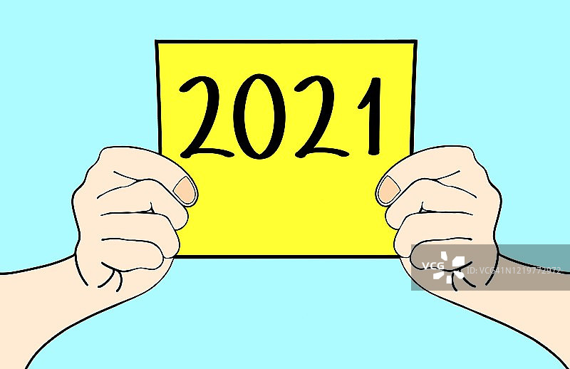 手拿一张写有2021的纸图片素材