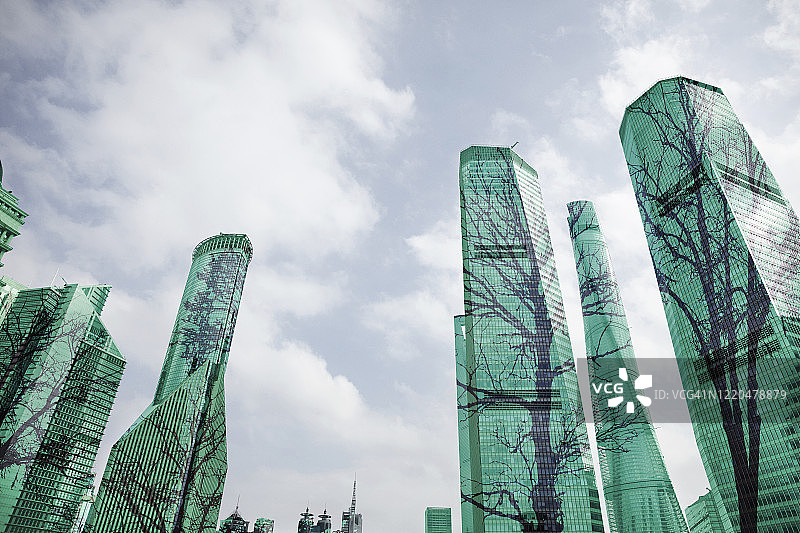 城市建筑上的树木合成图像图片素材