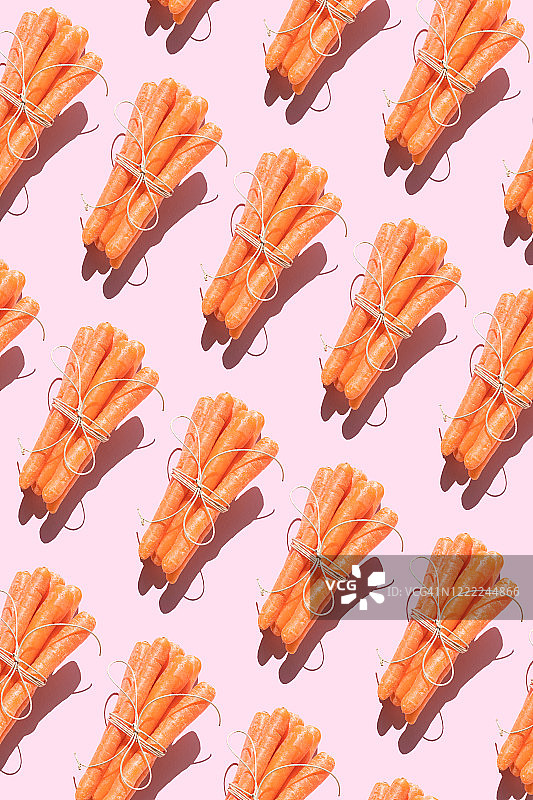 粉色背景上的胡萝卜重复图案图片素材