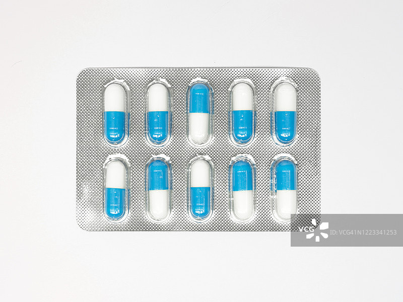 医药面板中的白色和蓝色胶囊图片素材