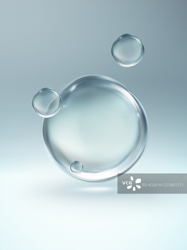 四个漂浮透明水滴特写图片素材