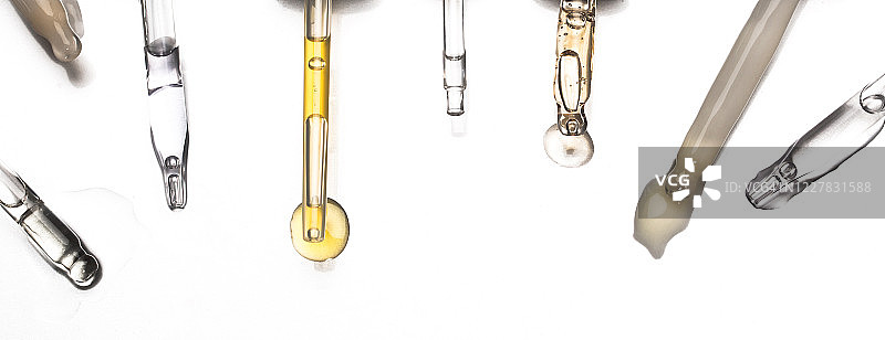 一组装有血清和油的移液器图片素材