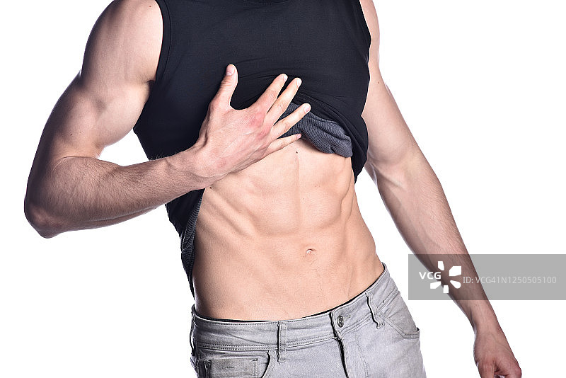 在白色背景下展示腹部肌肉的男人特写图片素材