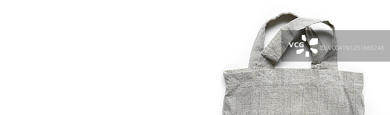 可重复使用的购物袋，米色背景下的再生材料网状袋。环保袋，无塑料banner。图片素材