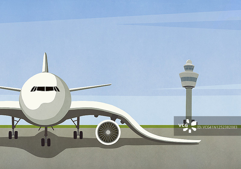 停在空停机坪上机翼下垂的飞机图片素材