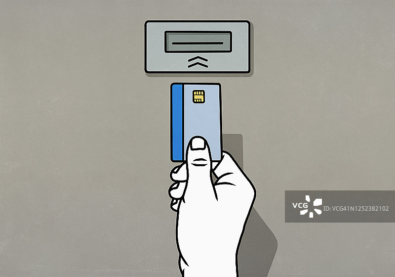 将芯片信用卡插入ATM机的手图片素材