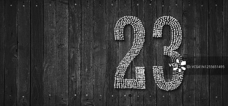 木制背景上的数字23图片素材