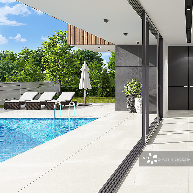 夏季日光下的奢华别墅游泳池内景图片素材