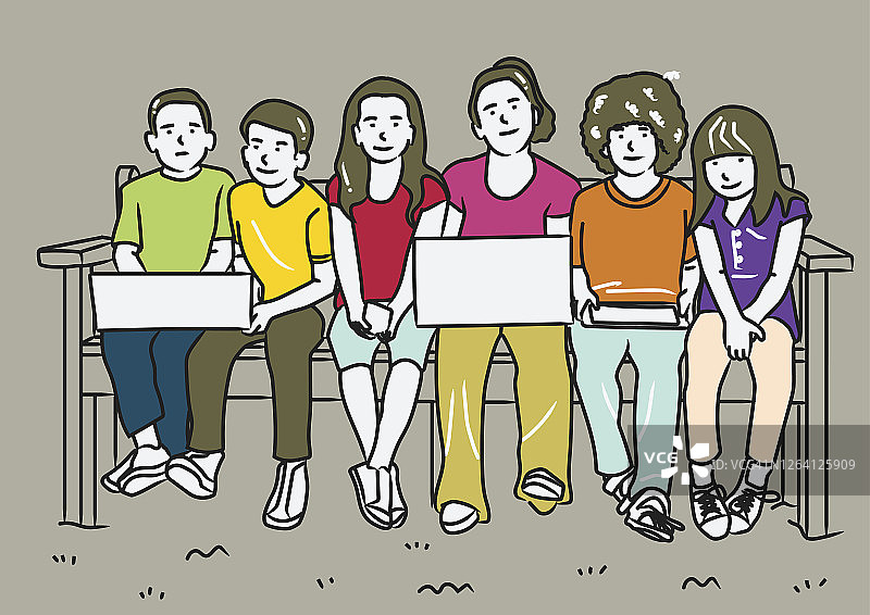 孩子们拿着笔记本电脑坐在长凳上图片素材