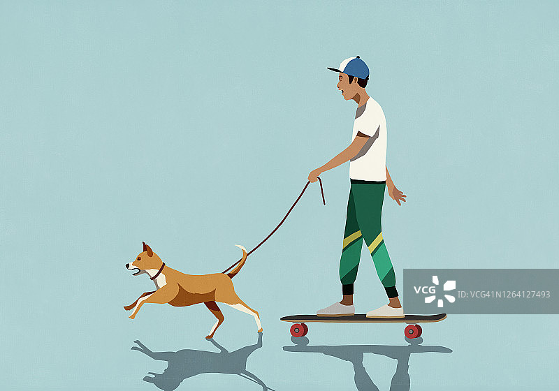 狗拉着系牵引绳的滑板少年图片素材