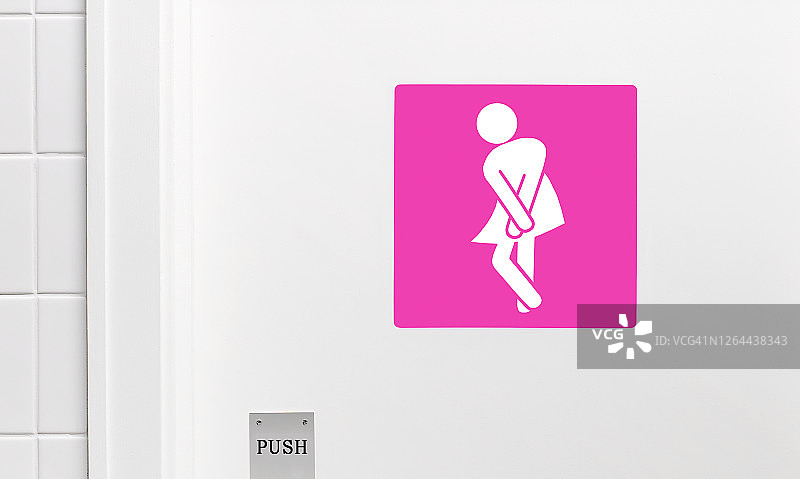 女性洗手间标志，双腿交叉表示有排尿的紧急需求图片素材