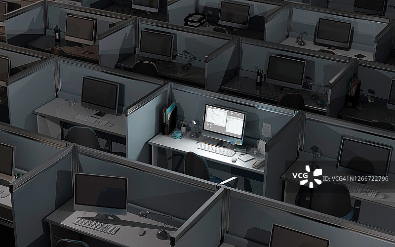 黑暗办公室中点亮的电脑屏幕图片素材