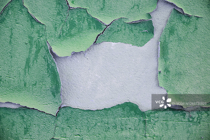 绿色油漆剥落的粉刷墙面：破旧的混凝土细节特写纹理背景图片素材