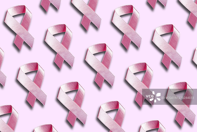 粉色背景上的多个粉色丝带图片素材