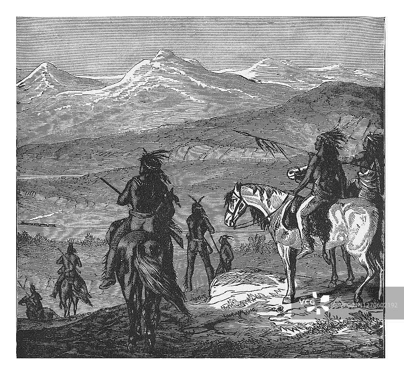 古老的雕刻插图：印第安人观看太平洋铁路上的第一列火车图片素材