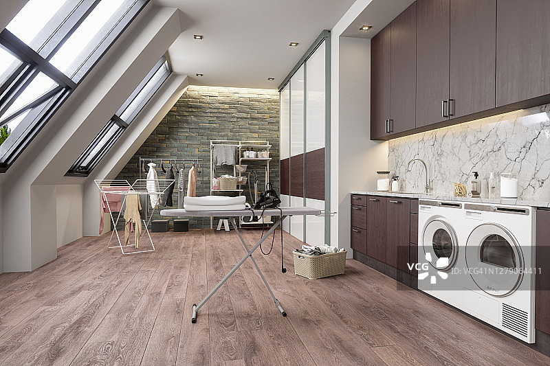 阁楼里的洗衣房，配有洗衣机、烘干机和熨衣板图片素材