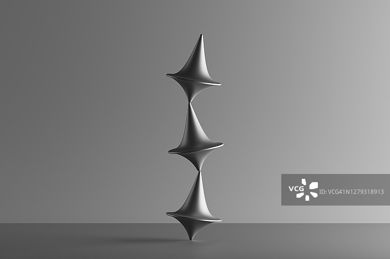 三个金属旋转陀螺相互平衡的3D渲染图片素材