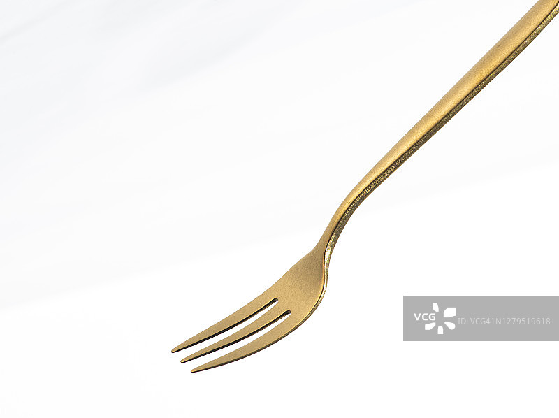 金色叉孤立在白色背景。图片素材