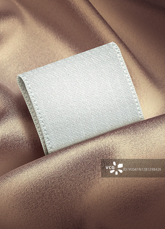 布料、丝绸、褶皱、金色、标签、商标特写图片素材