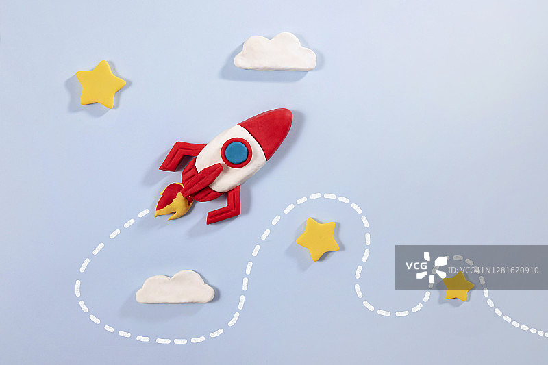 蓝色背景上的太空火箭图片素材