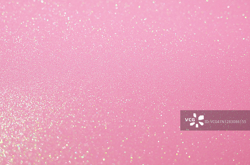 带有模糊闪光的闪光粉彩粉色节日背景，圣诞节、生日或节日背景图片素材