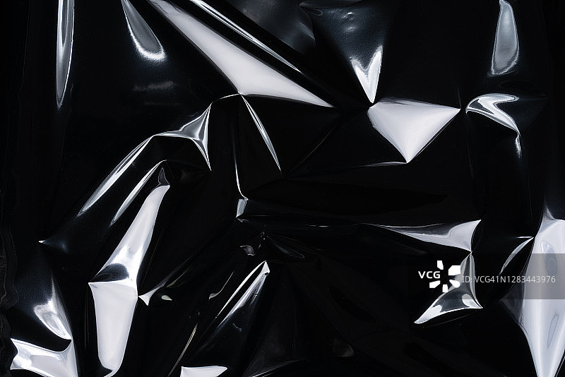 褶皱塑料箔纹理上的高光图片素材