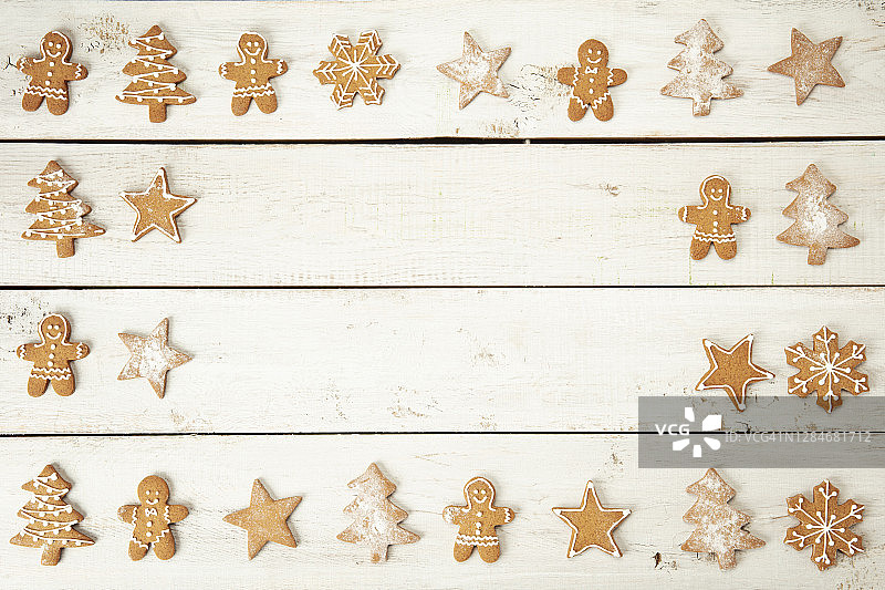 木桌上美味的圣诞姜饼饼干边框图片素材