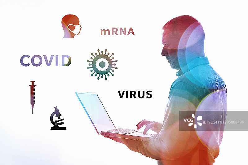 使用带新冠病毒科学相关图标笔记本电脑的男人图片素材