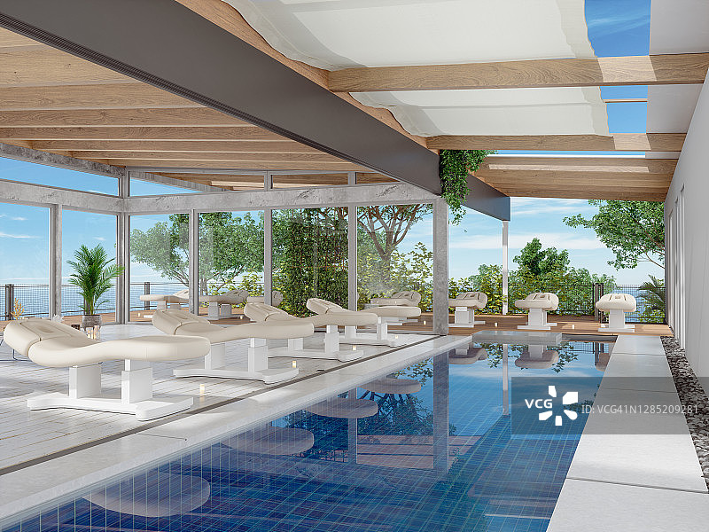 带躺椅、游泳池和海景背景的高档水疗酒店图片素材