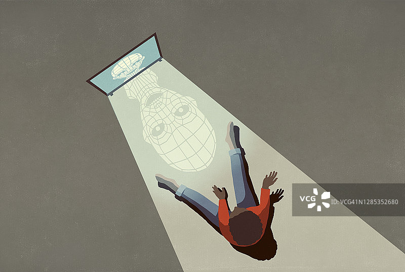 电脑屏幕上的网络欺凌，在男孩身上投下阴影图片素材