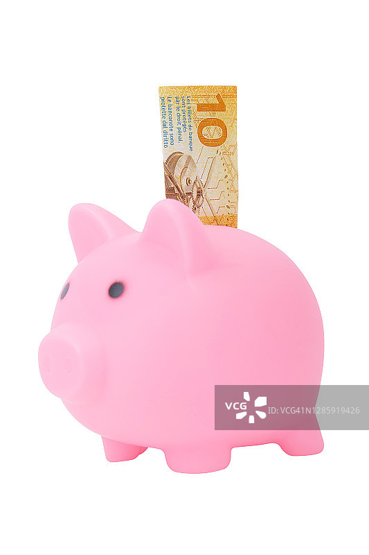 白色背景上隔离的带有10瑞士法郎的粉色小猪储蓄罐图片素材
