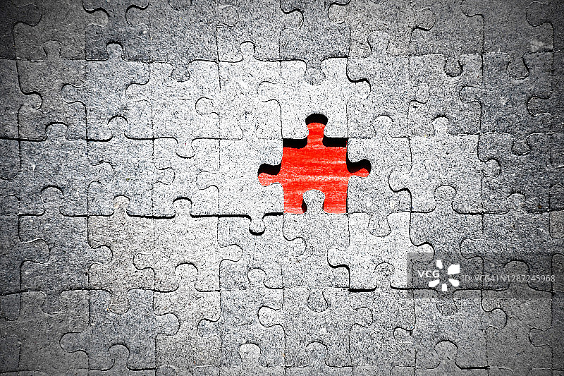 缺少红色碎片的拼图图片素材