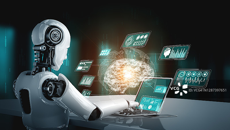 机器人使用笔记本电脑坐在桌旁进行大数据分析图片素材