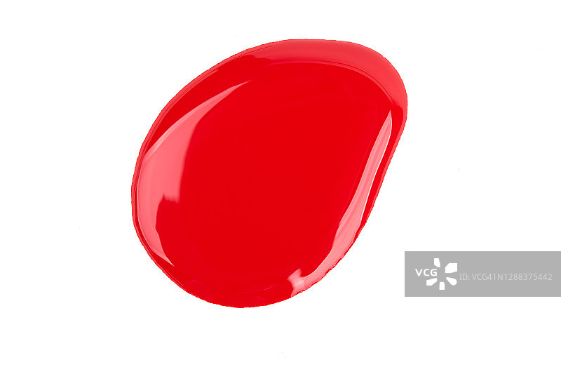 白色背景上洒落的红色指甲油图片素材