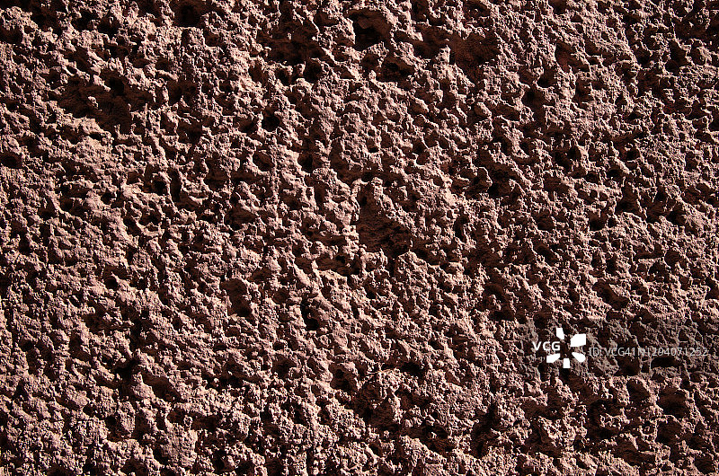 粉红色凹凸不平的灰泥墙图片素材